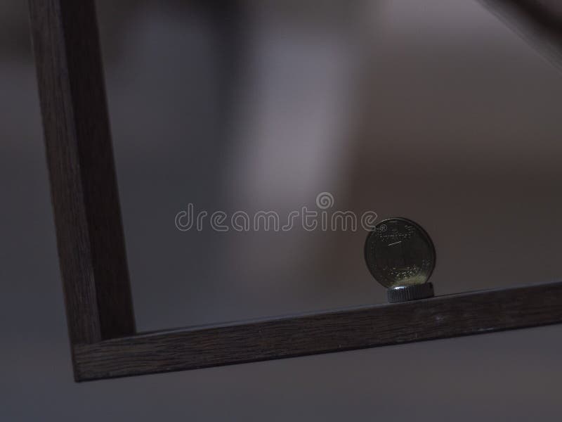 Metallic Ukrainian coin on a wooden plank. Ukrainian hryvnia coin stock photo Metallic Ukrainian coin on a wooden plank. Ukrainian hryvnia coin stock photo