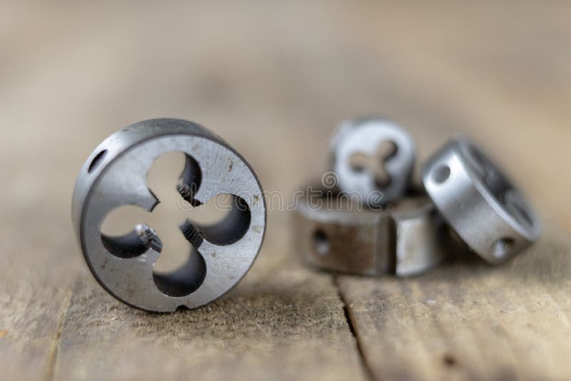 Metalwork tools on the workshop table. Threading dies and taps i royalty free stock photos
