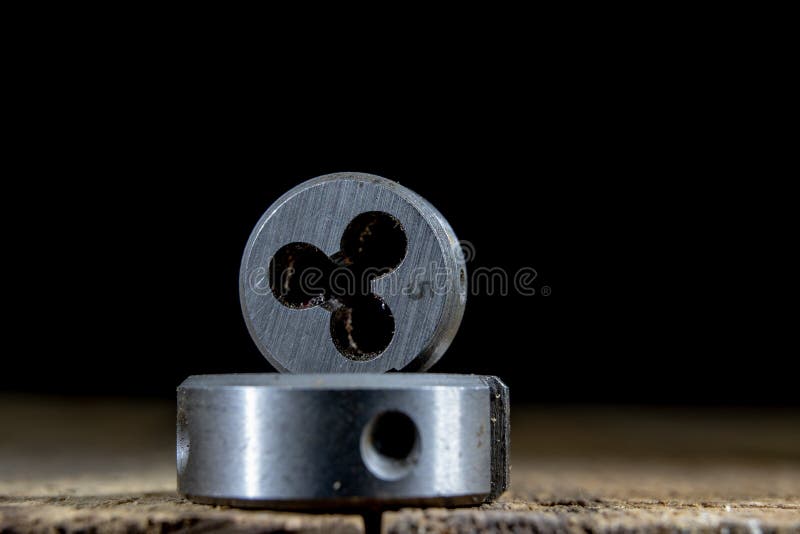 Metalwork tools on the workshop table. Threading dies and taps i stock photo