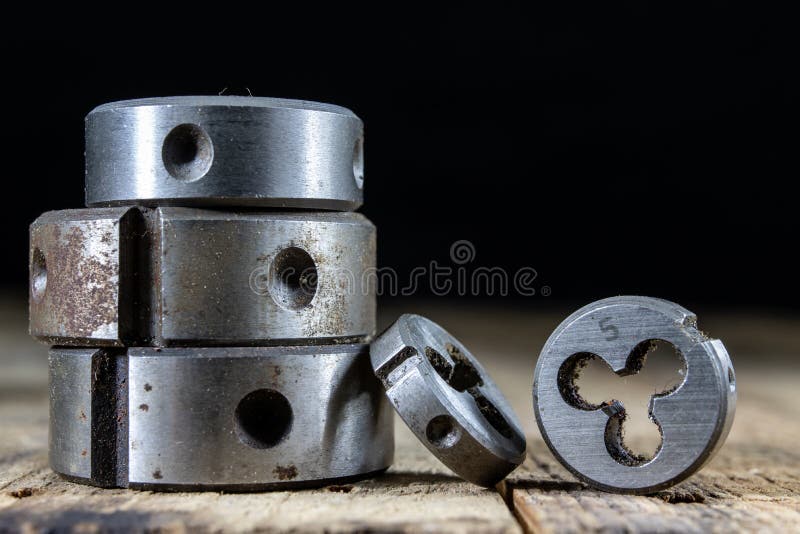 Metalwork tools on the workshop table. Threading dies and taps i royalty free stock photography