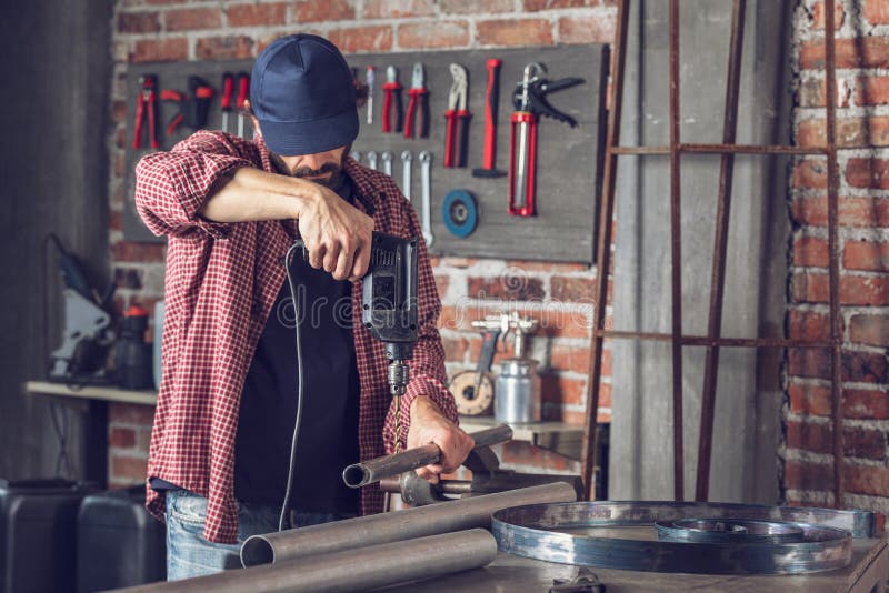 Metalworker Drilling a Hole in a Metal Pipe Stock Image Image of pipe
