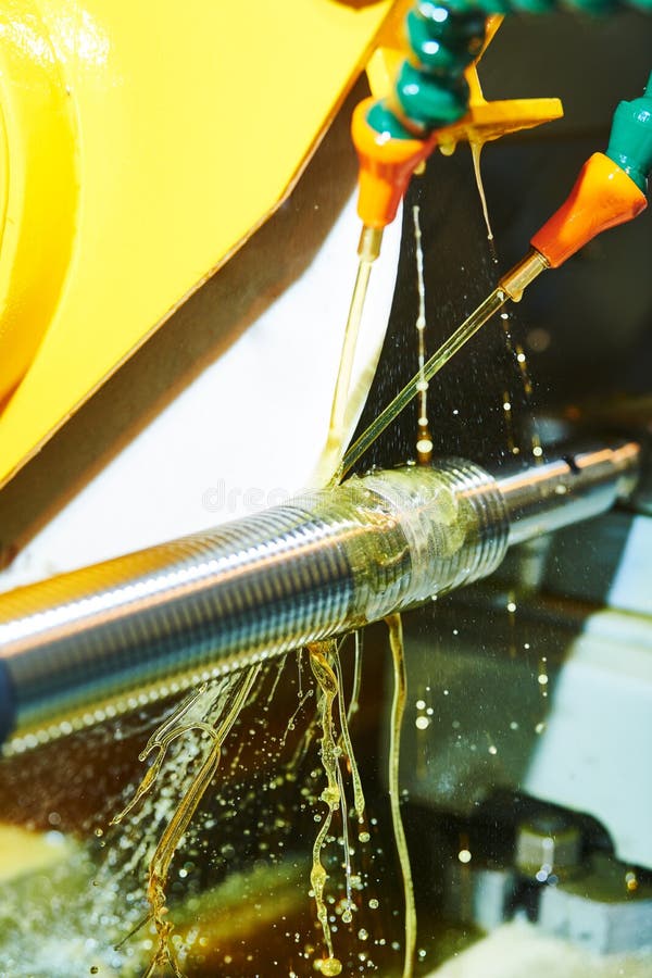 Metalworking industry. shaft thread cutting on polishing or grinding machine with oil lubrication. Metalworking industry. shaft thread cutting on polishing or grinding machine with oil lubrication