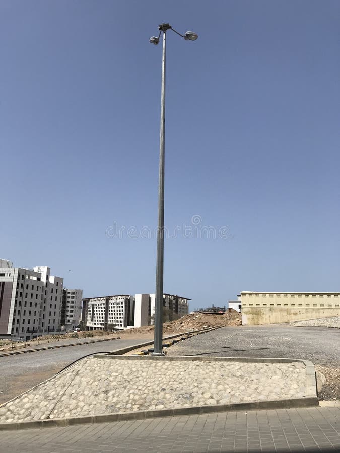 10 meter high Electric light pole carrying two flood lights for better lighting experience for the open car parking and can be royalty free stock photography 10 meter high Electric light pole carrying two flood lights for better lighting experience for the open car parking and can be royalty free stock photography