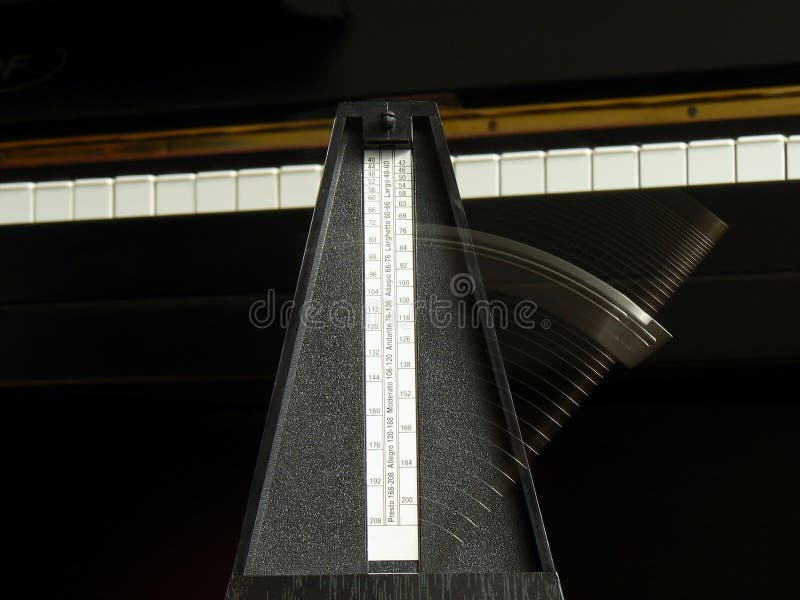 Metronome on the piano stock photo. Image of play, andante 16230882