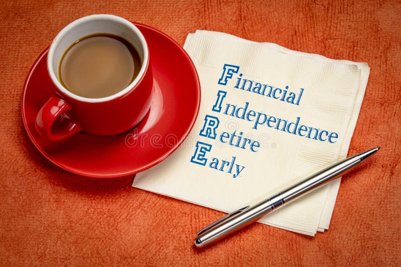 FIRE acronym - financial independence, retire early, handwriting on a napkin with a cup of coffee. FIRE acronym - financial independence, retire early, handwriting on a napkin with a cup of coffee