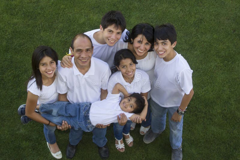 Top view of a Mexican family with the youngest member in arms. Top view of a Mexican family with the youngest member in arms