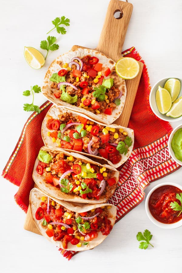 Mexican Beef and Pork Tacos with Salsa, Guacamole and Vegetables Stock