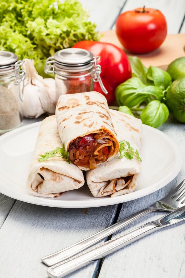 Mexican Burritos Wraps with Mincemeat, Beans and Vegetables Stock Image