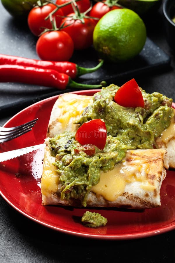 Mexican Chimichanga with Guacamole Dip Stock Photo Image of cookery, burrito 65575404