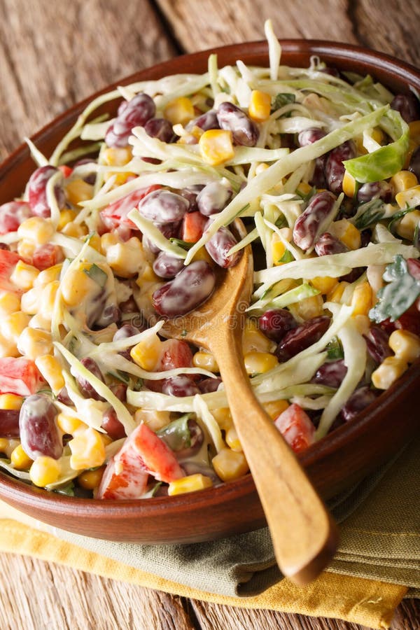 Mexican Coleslaw Salad with Beans, Corn, Pepper and Herbs Closeup in a ...