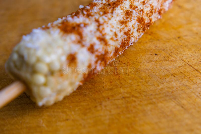 Mexican Corn with Chili Powder and Grated Cheese on a Wooden Surface Stock  Photo - Image of corn, meal: 213106962