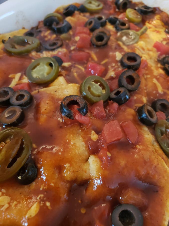 Mexican Dish for Dinner with Jalapenos Olives Tomatoes Enchilada Sauce
