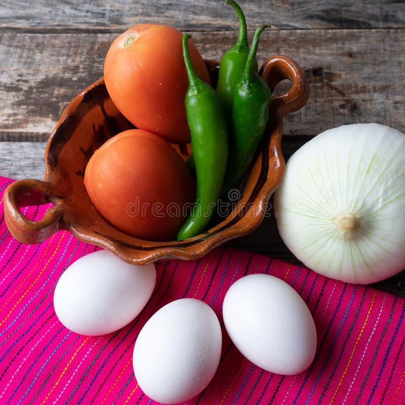 Mexican Eggs Ingredients. White Eggs, Serrano Pepper, Onion and Tomato