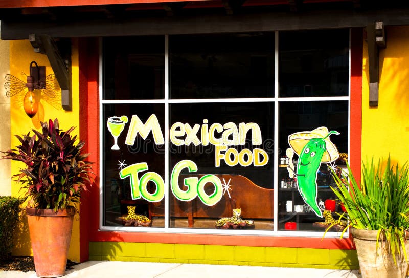 Mexican food to go hand painted store front sign on glass panes. Margarita and jalapeno pepper design. Orange, red, yellow