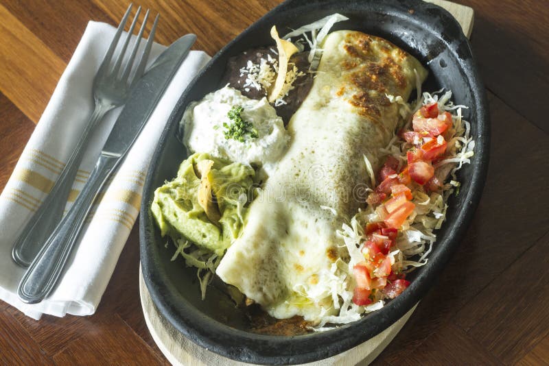 Mexican food: Tortilla with sour cream, avocado and tomato. stock image Mexican food: Tortilla with sour cream, avocado and tomato. stock image