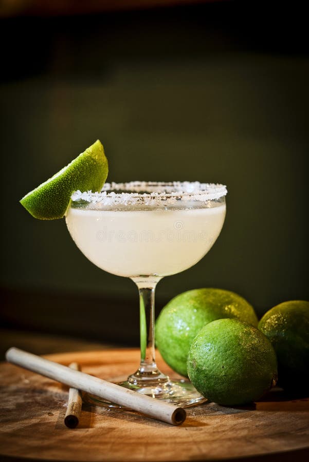 Mexican lemon lime margarita cocktail drink in bar stock photos Mexican lemon lime margarita cocktail drink in bar stock photos