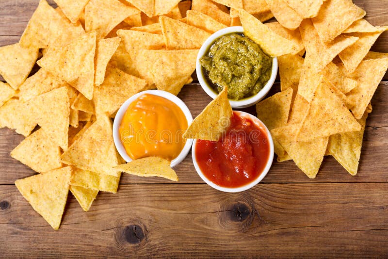 Mexican nachos corn chips with guacamole, salsa and cheese dip