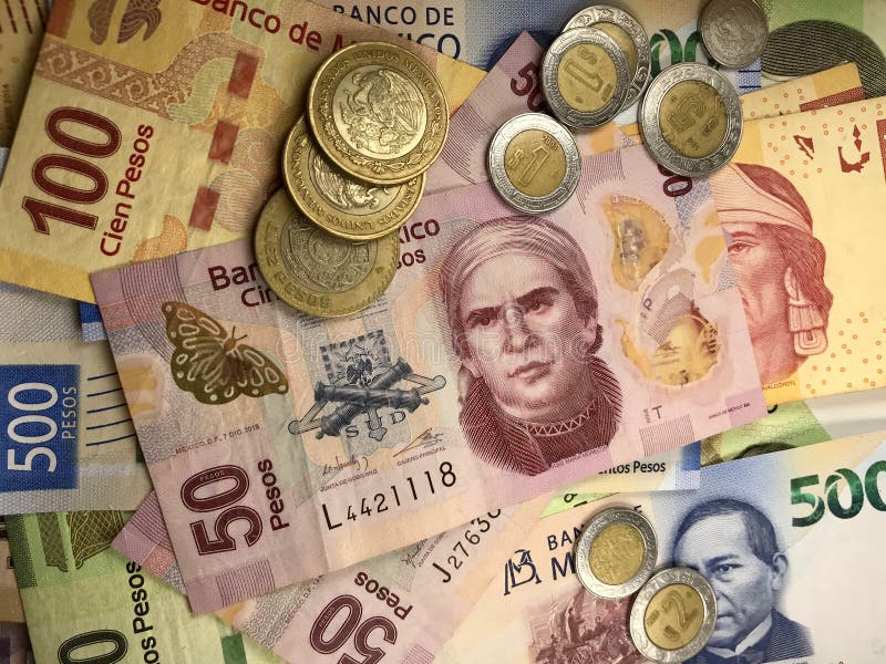 Mexican Peso Bills Spread Randomly Over a Flat Surface Editorial