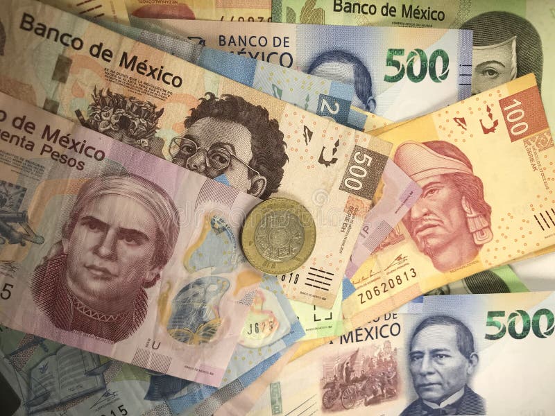 Mexican Peso Bills Spread Randomly Over a Flat Surface Stock Photo