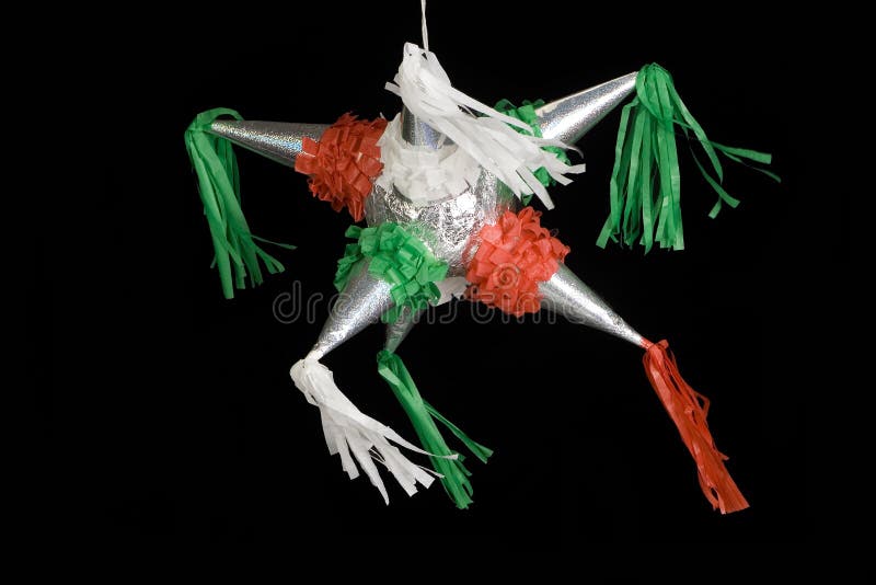 Mexican pinata decorated in red, green and white. Isolated on black background