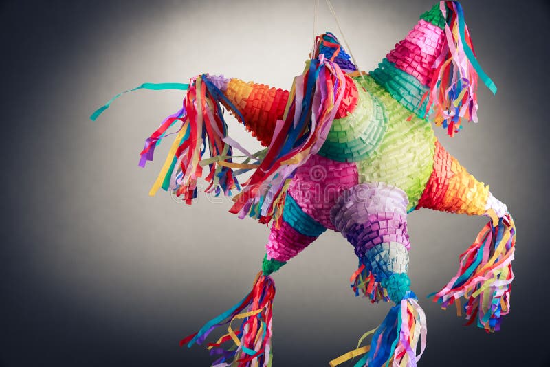 Colorful mexican pinata used in birthdays on a grey background. Colorful mexican pinata used in birthdays on a grey background