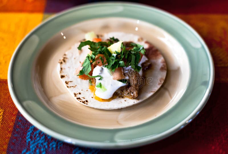 Mexican Tacos with Minced Meat, Beans and Spices on a Plate Stock Photo