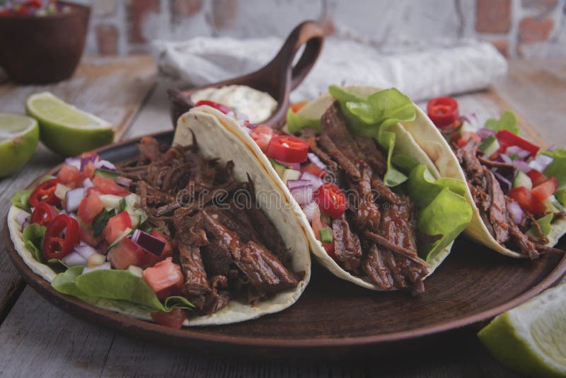 Mexican Tacos with Roasted Beef ,sauce and Salsa Tomato Stock Image