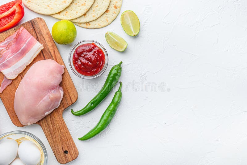 Mexican tacos with vegetables and meat Ingredient for cooking over white textured background, top view with space for text