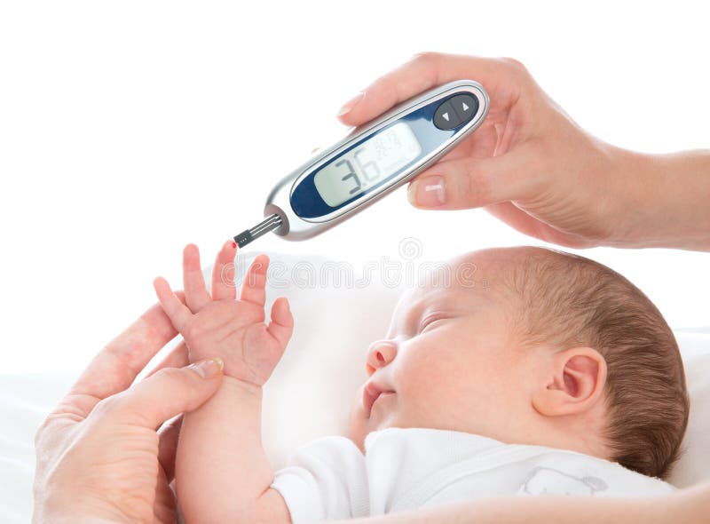 Doctor hand measuring glucose level blood chemistry test from diabetes patient child baby using glucometer and small drop of blood from finger and test strips isolated on a white background. Doctor hand measuring glucose level blood chemistry test from diabetes patient child baby using glucometer and small drop of blood from finger and test strips isolated on a white background