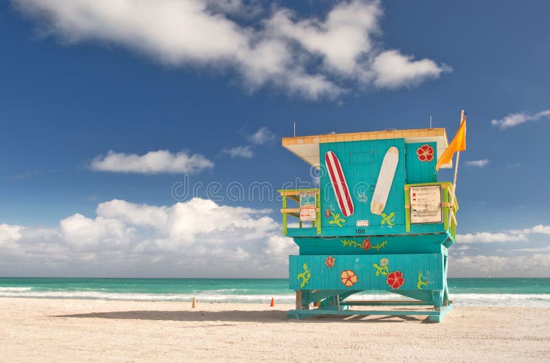 Miami Beach Florida, lifeguard house in a typical colorful Art Deco style on a sunny summer day, with blue sky and Atlantic Ocean in the background. World famous travel location.