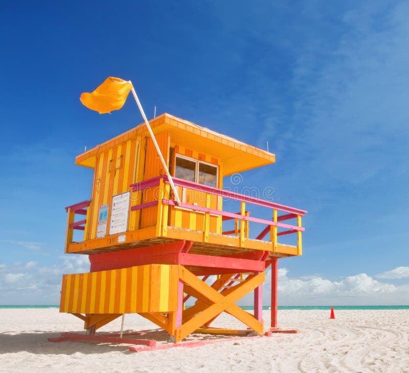 Miami Beach Florida, lifeguard house in a typical colorful Art Deco style on a sunny summer day, with blue sky and Atlantic Ocean in the background. World famous travel location.