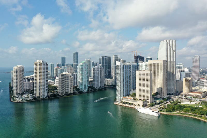 Miami, Florida - April 17, 2021 - Aerial view of entrance to Miami River and surrounding residential and office towers in downtown Miami. Miami, Florida - April 17, 2021 - Aerial view of entrance to Miami River and surrounding residential and office towers in downtown Miami.