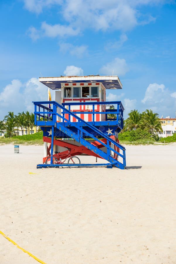 Miami South Beach, lifeguard house in a colorful Art Deco style at sunny summer day with the Caribbean sea in background, world famous travel location in Florida, USA