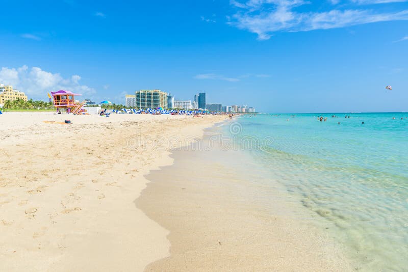 Miami South Beach, lifeguard house in a colorful Art Deco style at sunny summer day with the Caribbean sea in background, world famous travel location in Florida, USA