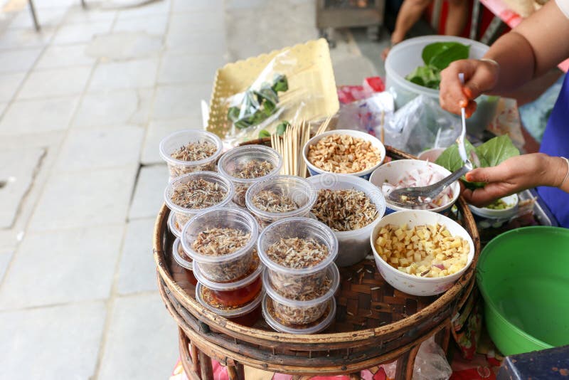 Local seller make Thai Fresh Leaf Wrapped Bite Size Appetizer, Miang Kham at bangrak, Bangkok, Thailand royalty free stock photo Local seller make Thai Fresh Leaf Wrapped Bite Size Appetizer, Miang Kham at bangrak, Bangkok, Thailand royalty free stock photo