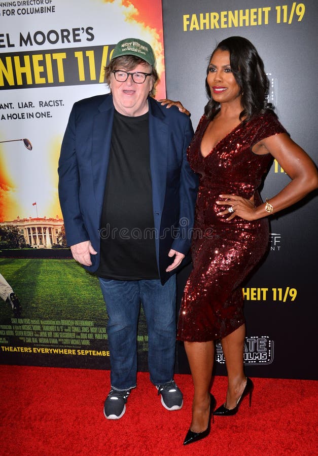 Michael Moore & Omarosa Manigault Newman arkivbild
