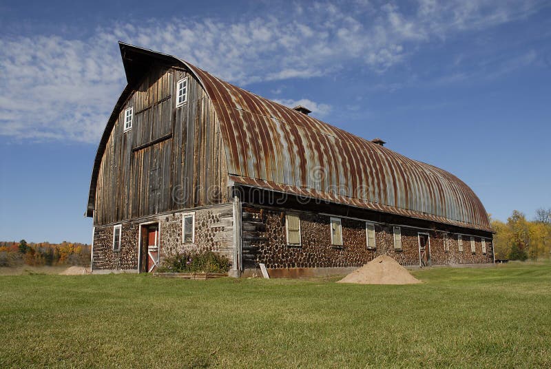 This barn is located in the western end of Michigans Upper Peninsula. The wall are made of logs 16 long mortared togater to form a cordwood wall. Its fabulous to see. This barn is located in the western end of Michigans Upper Peninsula. The wall are made of logs 16 long mortared togater to form a cordwood wall. Its fabulous to see.