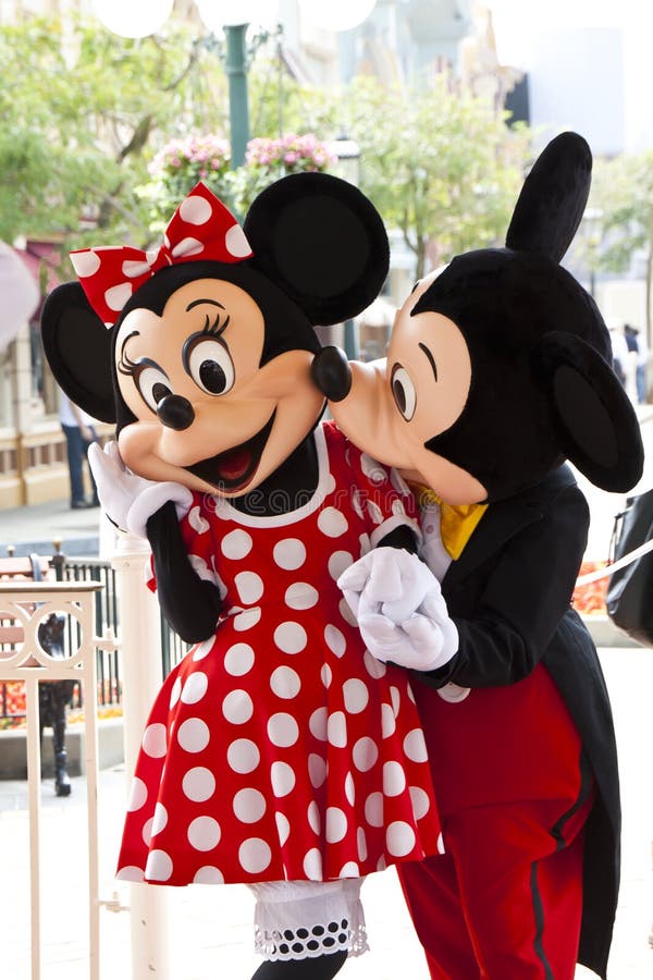 Mickey mouse kissing Minnie Mouse during character meet and greet in Hong Kong Disneyland. Mickey mouse kissing Minnie Mouse during character meet and greet in Hong Kong Disneyland