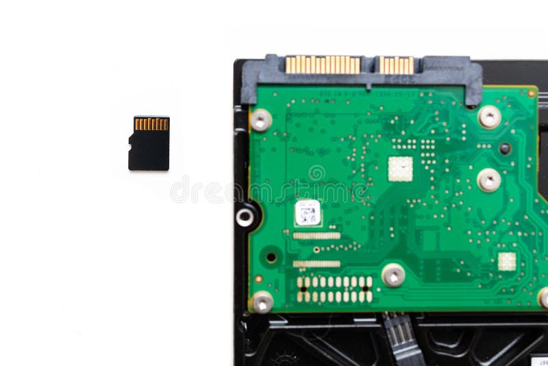 Micro SD (Secure Digital) Card Next To HDD Hard Disk Drive Stock Image