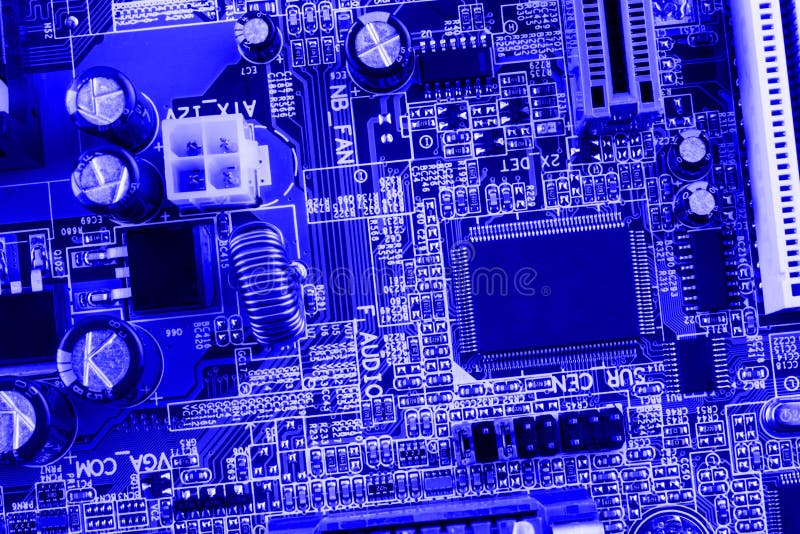 Microchip, filter, capacitors, battery, connectors on the motherboard of a modern computer blue background close macro royalty free stock photos Microchip, filter, capacitors, battery, connectors on the motherboard of a modern computer blue background close macro royalty free stock photos
