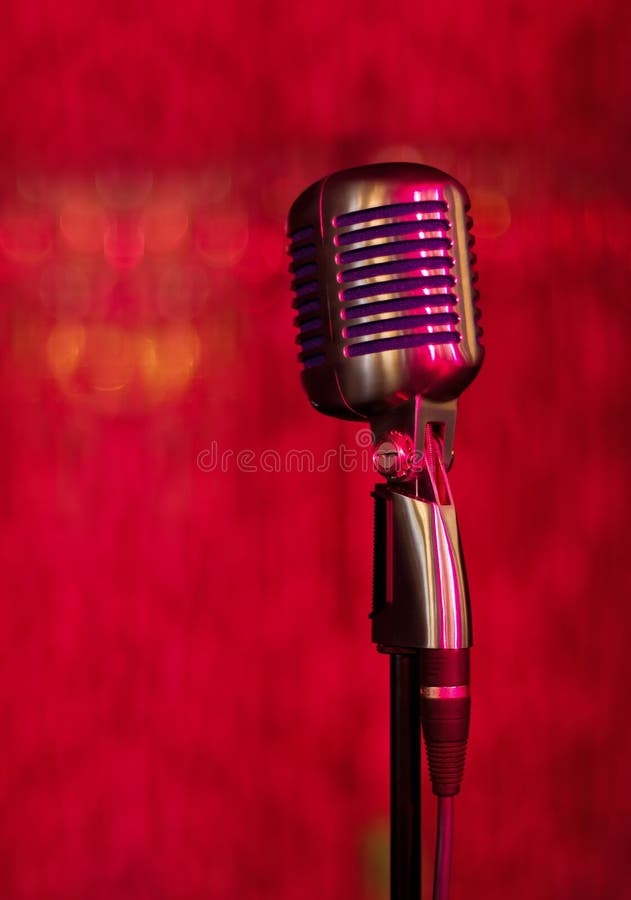 Vintage microphone on red background. Vintage microphone on red background