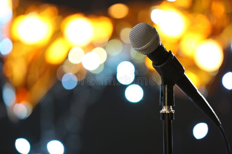 Microphone against festive lights, space for text