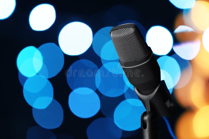 Microphone against festive lights, space for text