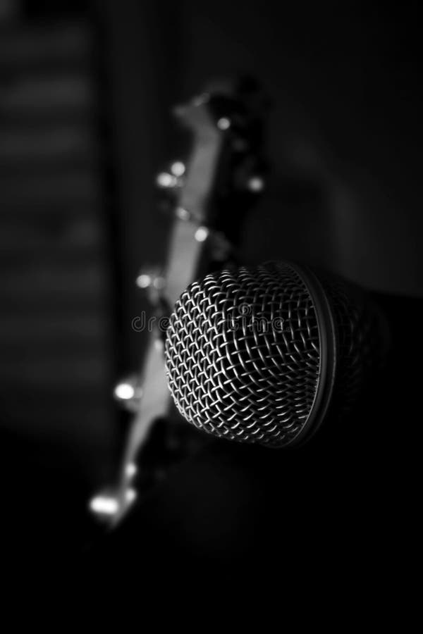 Microphone Closeup with Bass Guitar in the Background Stock Image