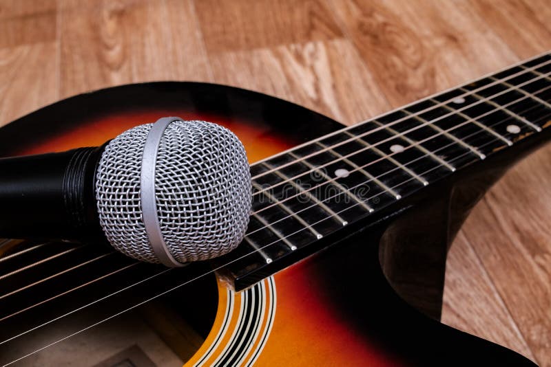 Microphone and Guitar on a Wooden Background Stock Image Image of