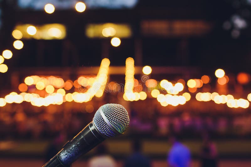Microphone on a Stand Up Comedy Stage with Colorful Bokeh , High