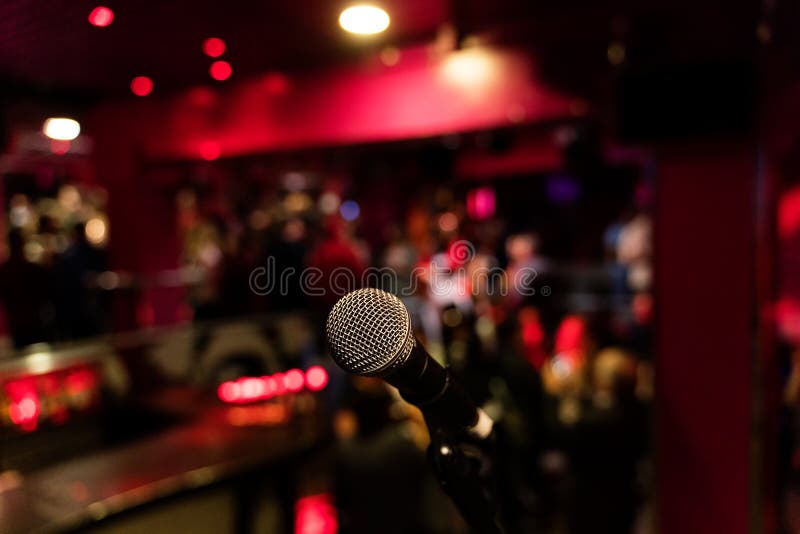 Microphone on a Stand Up Comedy Stage with Colorful Bokeh , High