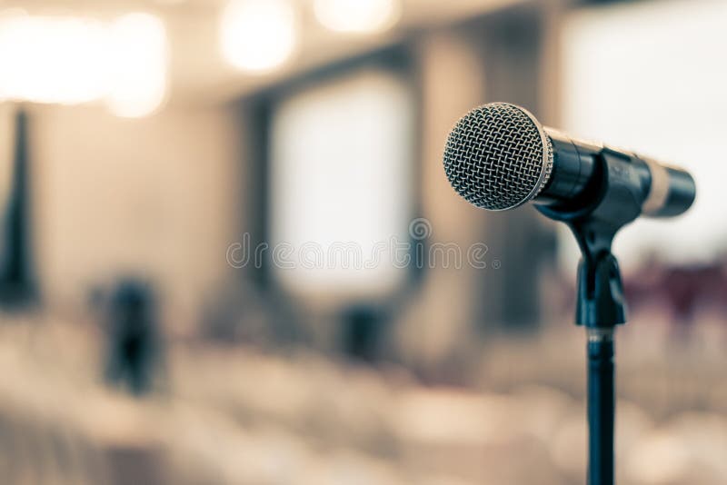 Microphone voice speaker in business seminar, speech presentation, town hall meeting, lecture hall or conference room in corporate