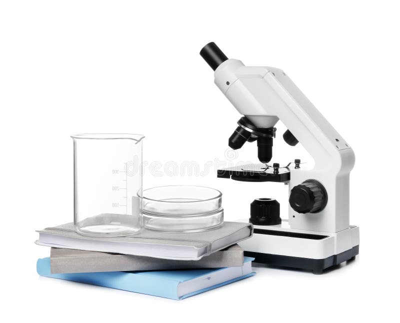 Microscope, books and medical students stuff isolated