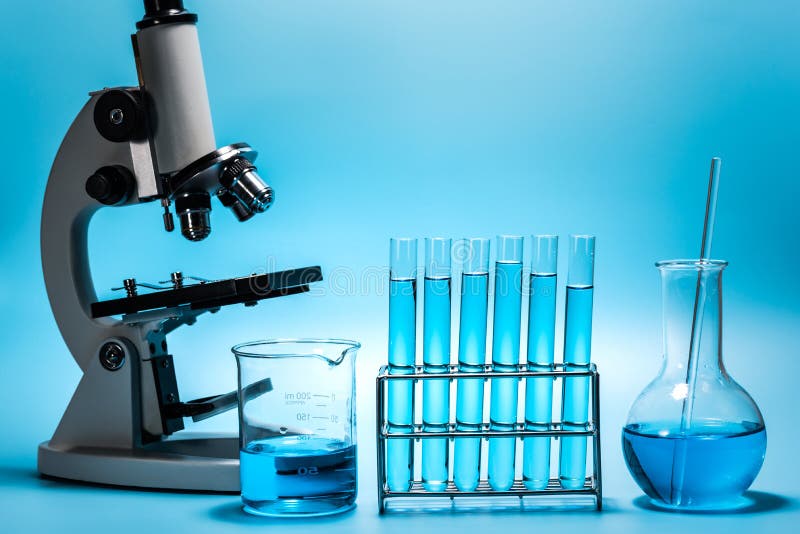 Microscope And Laboratory Test Tube On Light Blue Background , Science ...